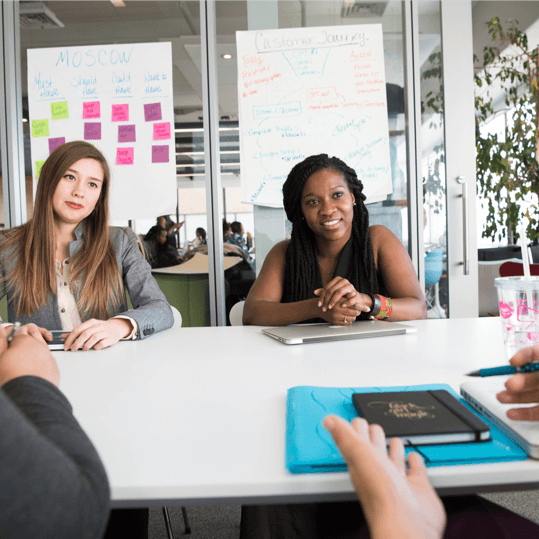 Group discussion at a table within a office environment